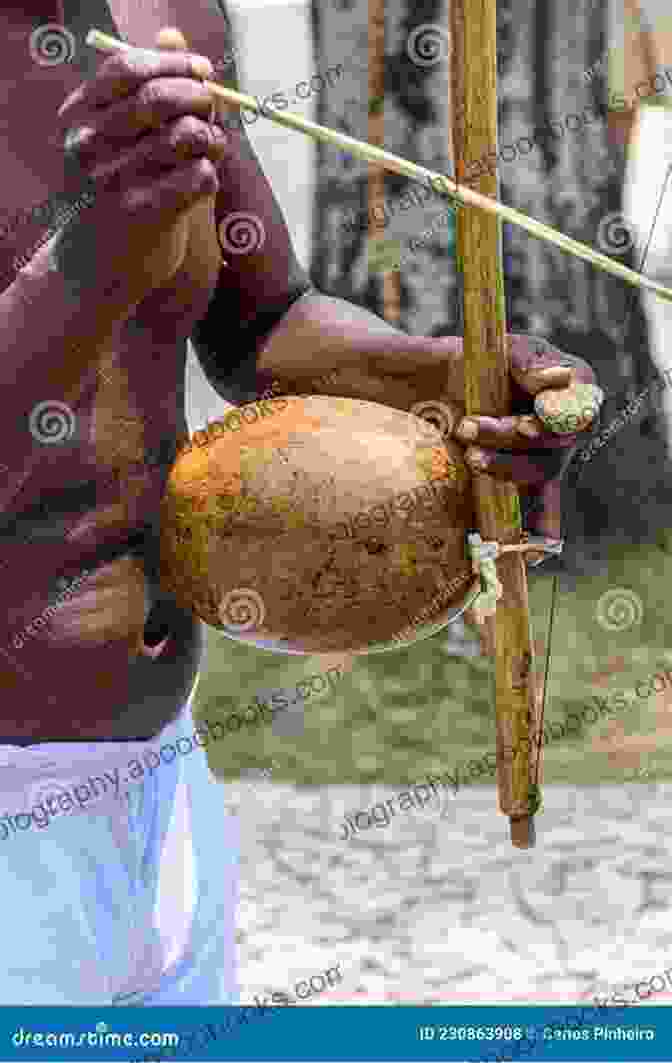 A Musician Playing The Berimbau, A Traditional Afro Brazilian String Instrument The Berimbau: Soul Of Brazilian Music