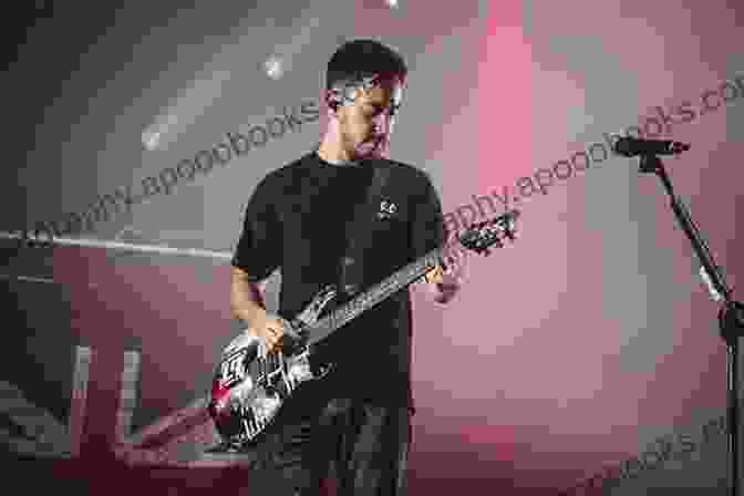 Confident Bassist Performing Onstage, Captivating The Audience With Their Bass Guitar Skills Play Bass (Bass Guitar Essentials By Stuart Clayton)