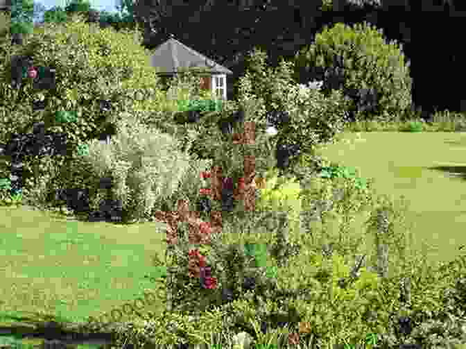 Lush Garden Surrounding Kermorvan Cottage, Featuring Vibrant Flower Beds, Manicured Lawns, And A Charming Seating Area Amidst The Tranquility Of Nature Kermorvan: Our Small Cottage In Brittany